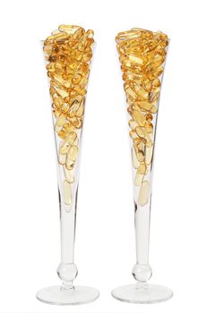Two glasses with gold boluses