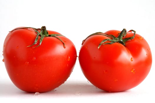 Two red, fresh, and juicy tomatoes