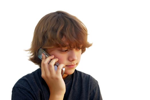 Teen boy talking on mobile phone isolated on white background.