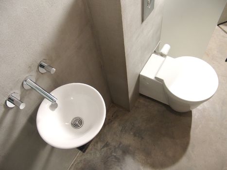toilet in a bathroom and sink