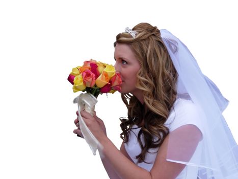 A young bride smelling her bouquet on a white background