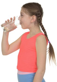 Girl drinks water from a glass
