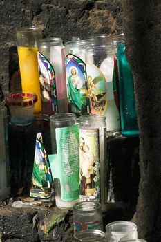 Devotional candles on an outdoor altar