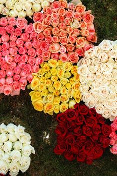 Different bouqets of roses forming pattern