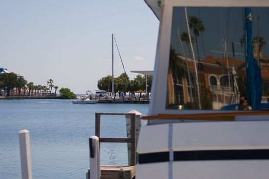 Marina View with Reflections was captured in a St. Petersburg Florida Marina. A Beautiful Reflection is captured in the corner of a window.
