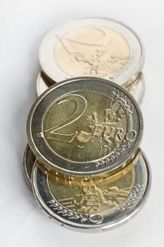 several euro coins on white background