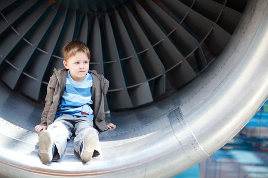 Boy inside turbine