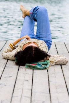 woman lying near the river