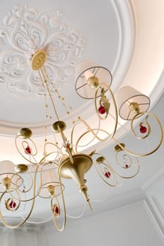 beautiful chandelier with lampshades in a room