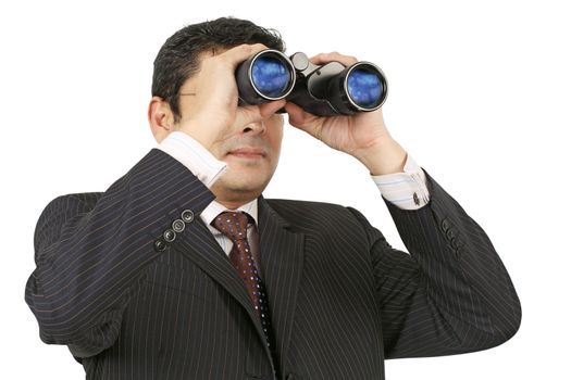 Businessman searching with binoculars