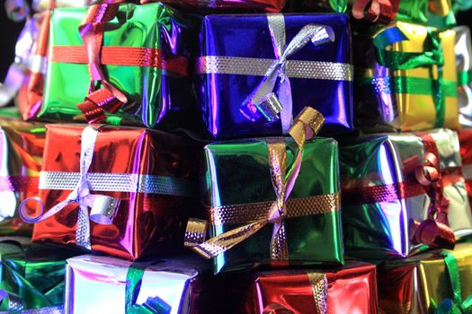 Stack of gifts wrapped in foil