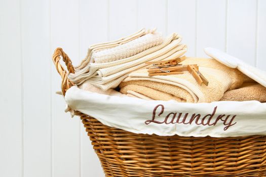 Clean towels in wicker basket 