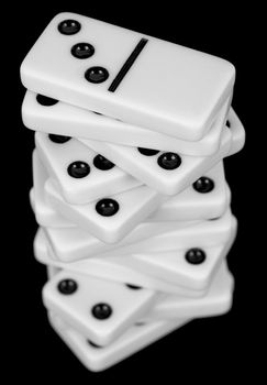 Pile from dominoes on black background