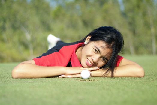 Female golf player on green