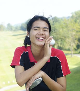 Female golf player laughing