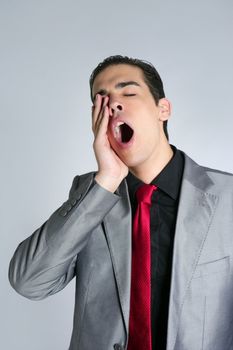 Businessman yawn boring on gray background