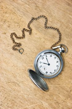 Pocket watch against the  wooden planks 