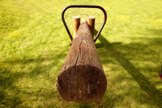 old wooden teeter totter in the park