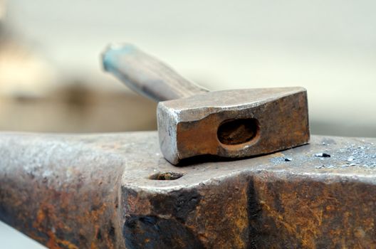 a hammer on an anvil of a blacksmith