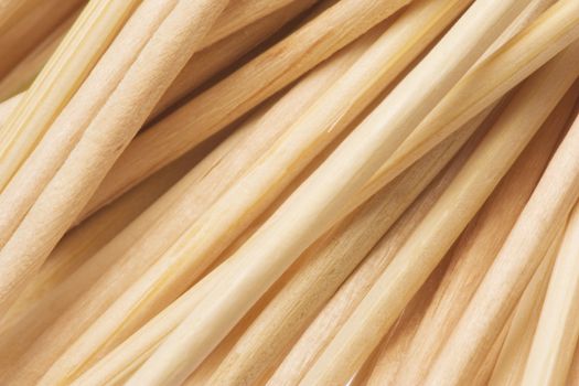 Isolated macro image of wooden toothpicks texture.