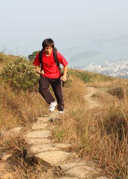 Sport hiking in mountains, walking and backpacking 