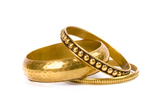 three golden bracelets