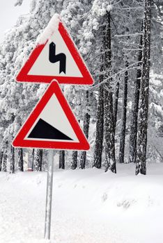 Traffic road sign in snow