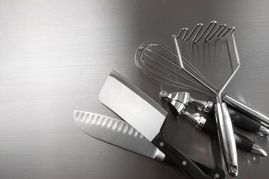 Kitchen utensils on stainless steel