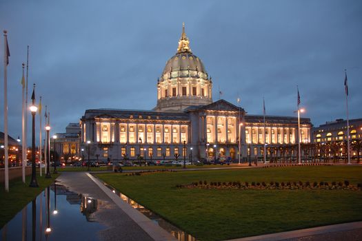 San Francisco City hall illuminated at night.with a reflection after a rain