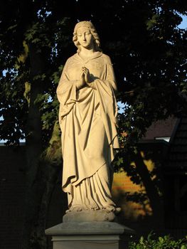 more than a hundred years old statue of Virgin Mary on a public place in northern Germany