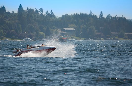 Speedboat Sprays Water and Waves