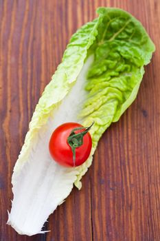Lettuce leaf and a cherry tomato