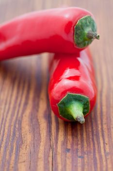 Two large red cayenne chili peppers