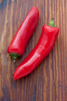 Two large red cayenne chili peppers