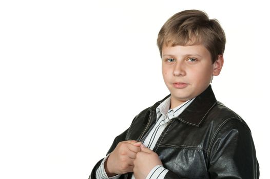 Portrait of the teenager in a leather jacket. It is isolated on a white background
