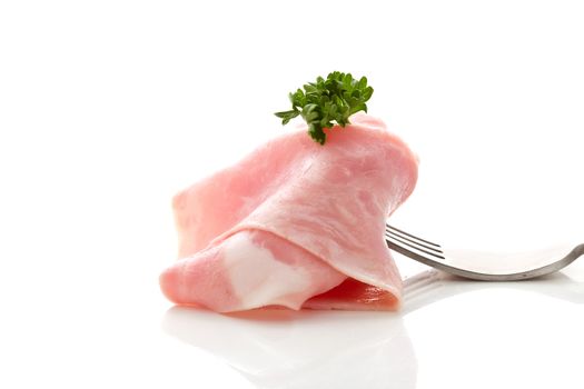 Soft ham slice wrapped on fork
