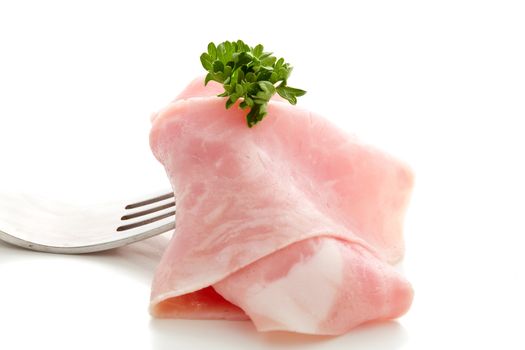 Soft ham slice wrapped on fork