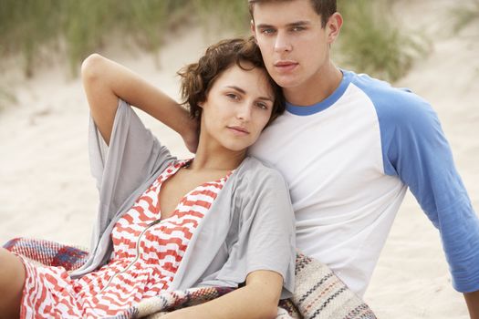 Romantic Young Couple Embracing On Beach