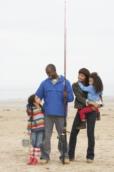 Family On Beach Fishing Trip