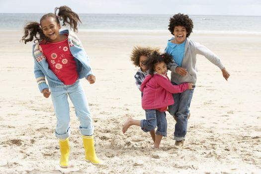 Happy children playing on beach