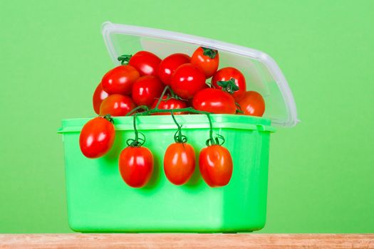 container with fresh tomatoes