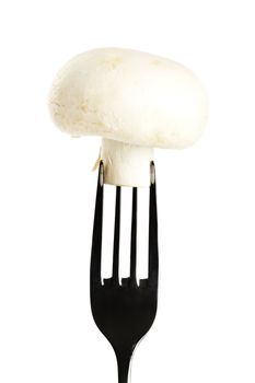 white mushroom on a fork