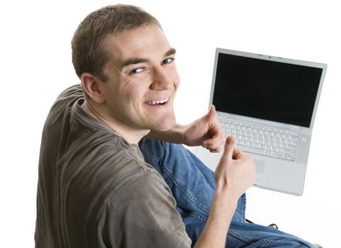 Satisfied Young Man Using a Laptop