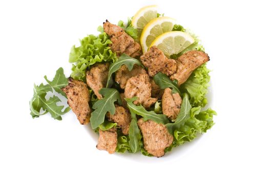 Chicken salad with dropped leaves over white background
