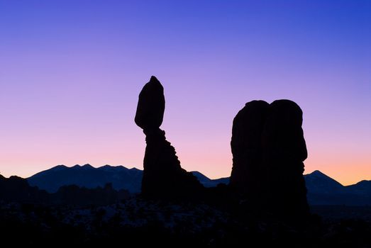 Balanced Rock and the La Sal Mountains at sunrise, Arches National Park, Grand County, Utah, USA