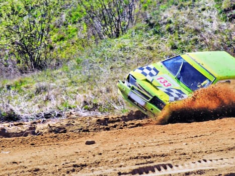 The car turns over on sand road racing