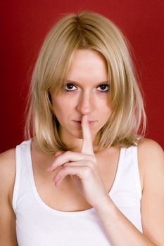 woman with finger on lips