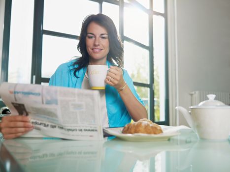 woman having breakfast at home