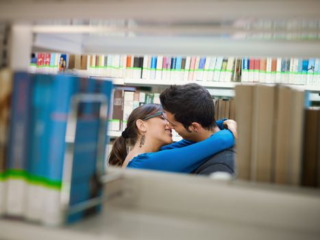 students kissing in library