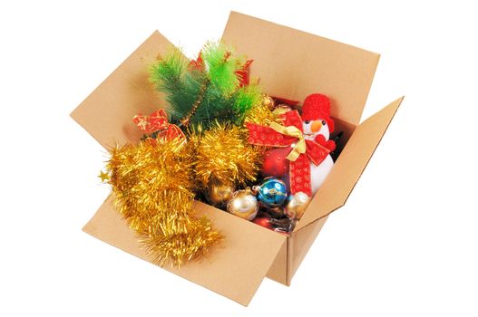 Box with Christmas decorations. Isolated on white.